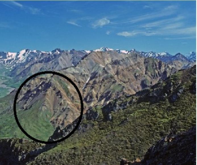 The Image Shows Mountains In Alaska.Which Describes The Main Feature Of The Circled Area Of These Mountains?