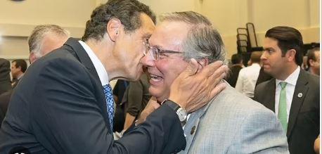 use the photograph to answer the question. this photograph shows the president and the governor of new