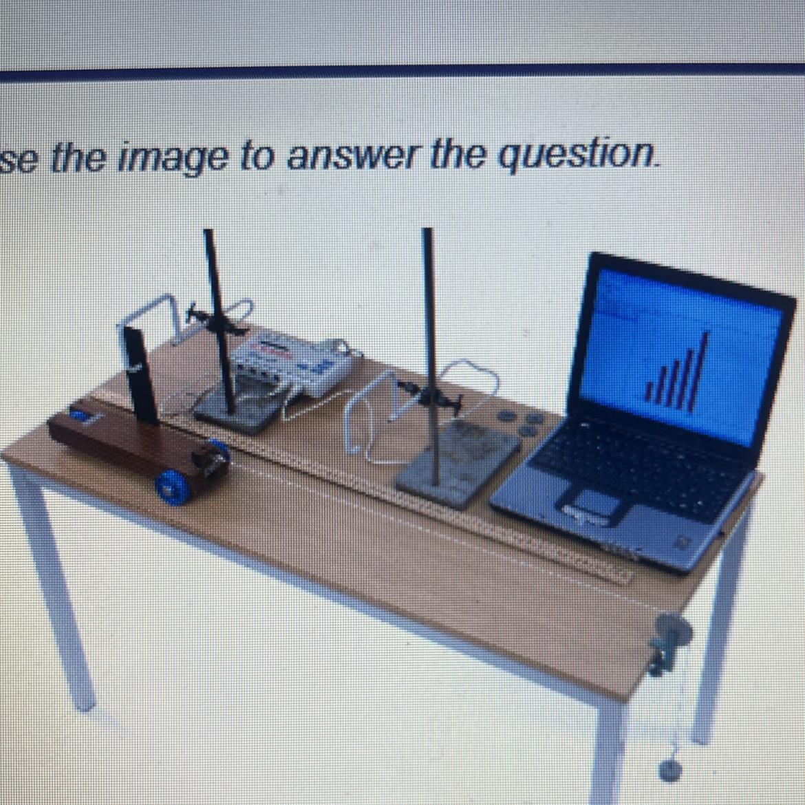 Students are using the experimental setup shown in the image in which the two ends of a string are attached