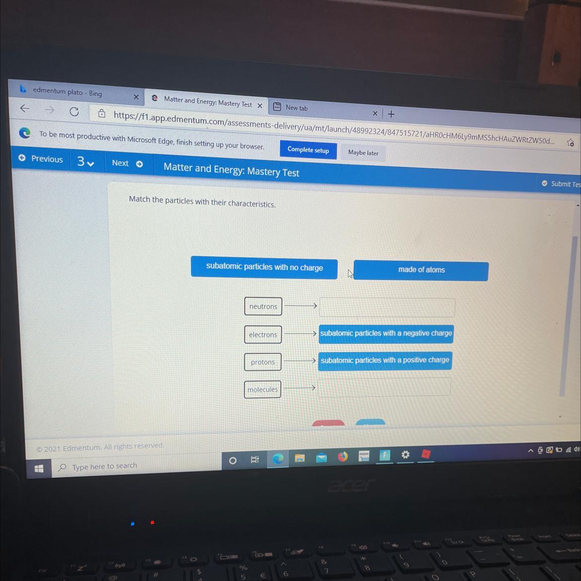 Drag the tiles to the correct boxes to complete the pairsMatch the particles with their characteristics.subatomic