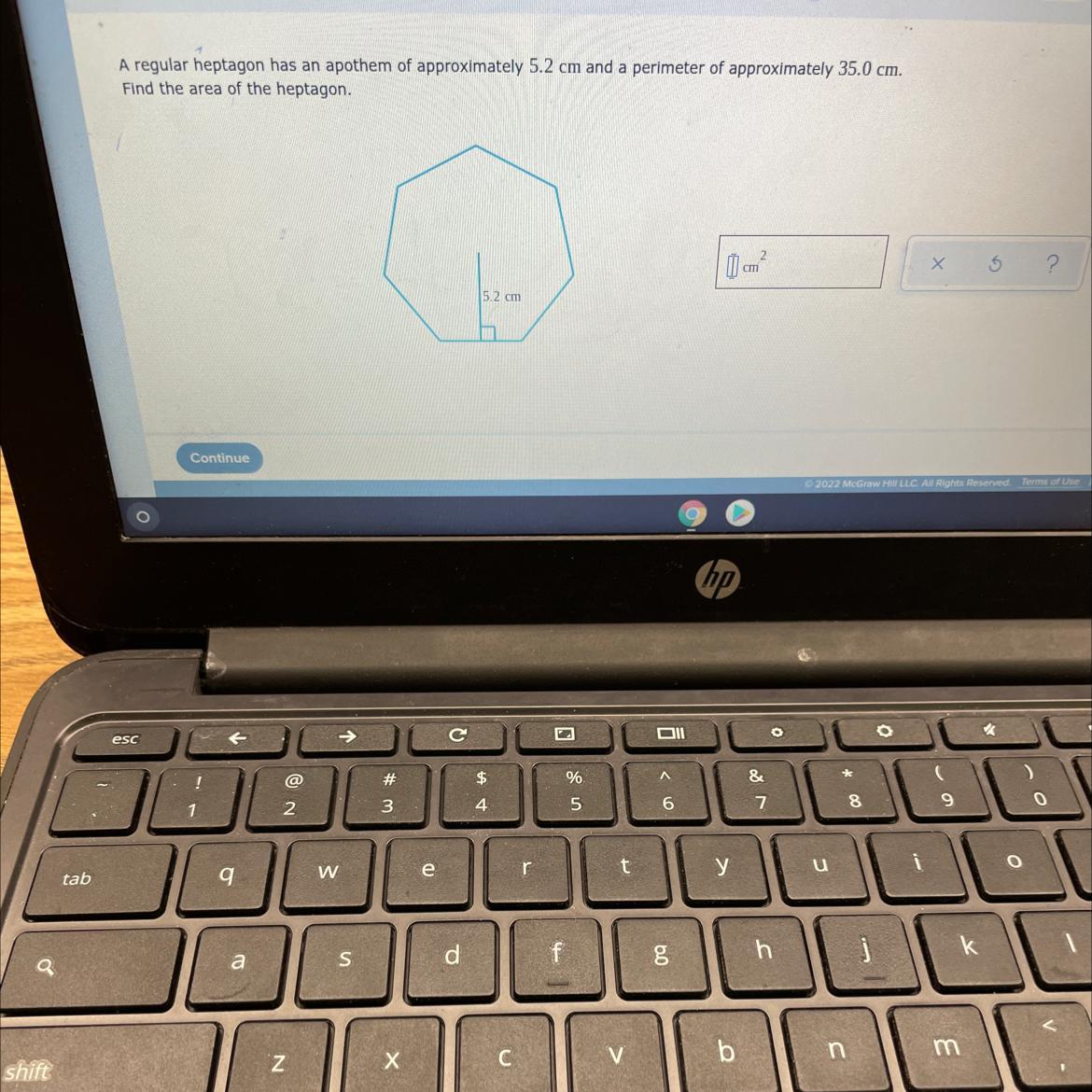 A regular heptagon has an apothem of approximately 5.2 cm and a perimeter of approximately 35.0 cm.Find