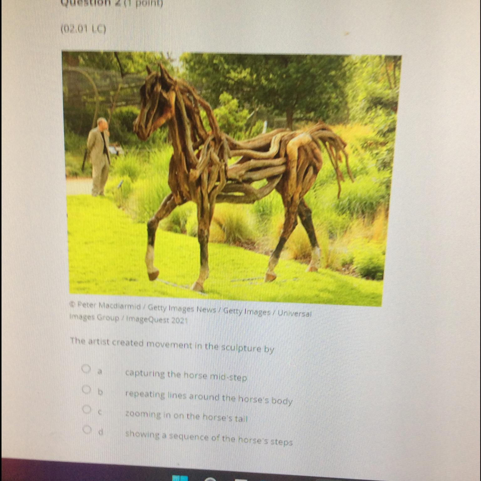 The artist created movement in the sculpture by A. Capturing the horse mid-stepB. Repeating lines around